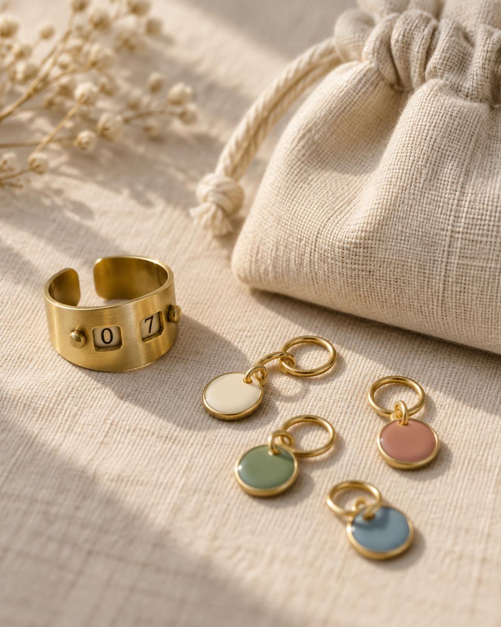 Glow brass row counter, enamel stitch markers, and linen pouch